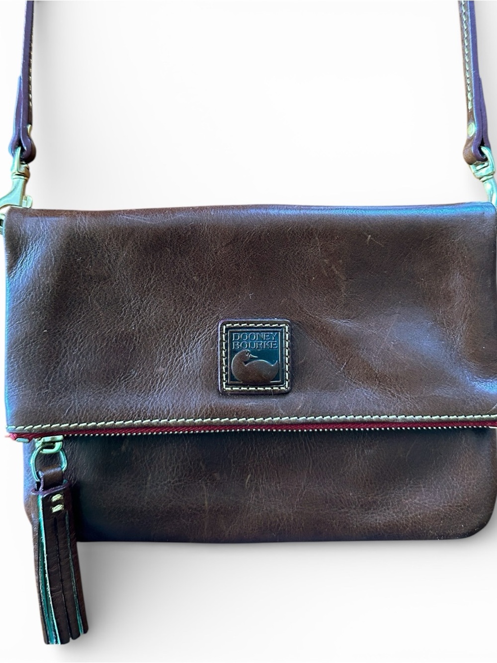 Dooney & Bourke Florentine Foldover Zip Crossbody in the shade Chestnut.